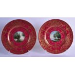 A GOOD PAIR OF ROYAL WORCESTER CLARET GROUND CABINET PLATES painted with landscapes by Evans. 26.5