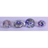 A COLLECTION OF FOUR VINTAGE GLASS PAPERWEIGHTS including a facetted millifiore example. Largest 6.