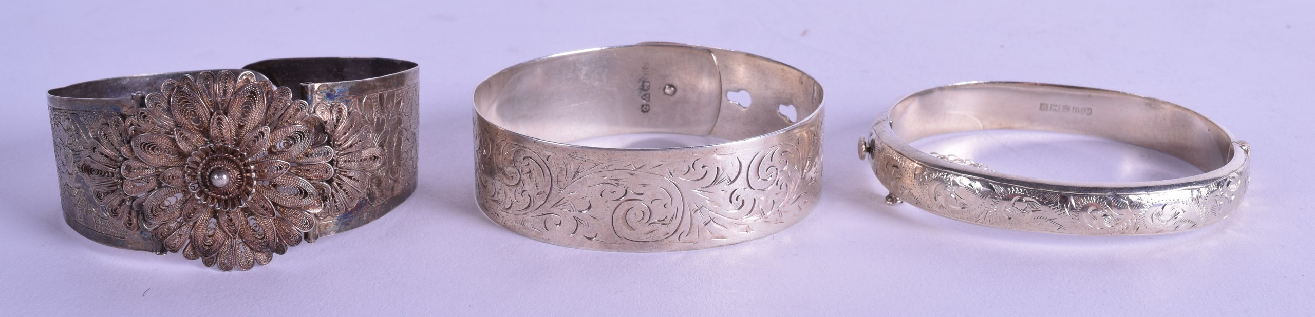 THREE ANTIQUE SILVER BANGLES. (3)