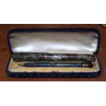 A BOXED CONWAY STEWART PEN together with a vintage parker pen. (2)