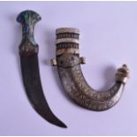 AN UNUSUAL 19TH CENTURY EASTERN DAGGER with abalone shell handle, the blade decorated all over