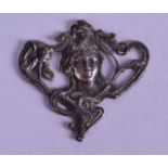 AN ART NOUVEAU SILVER PENDANT in the form of a stylised female.