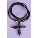 A VICTORIAN DARK HAIR TWIST CROSS NECKLACE.