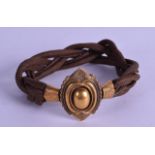 AN EARLY VICTORIAN YELLOW GOLD AND DARK TWIST HAIR BRACELET.