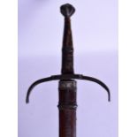 A GOOD 18TH CENTURY CONTINENTAL STEEL AND IRON SWORD within a carved leather scabbard, the blade