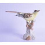 A ROYAL DUX PORCELAIN FIGURE OF A BIRD. 16.5 cm high.