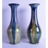 A PAIR OF EARLY 20TH CENTURY AULT TYPE BALUSTER VASES with drip glaze decoration. 37 cm high.