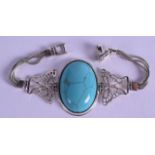 A SILVER AND TURQUOISE LADIES BRACELET.