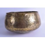 A 12TH CENTURY PERSIAN OR SYRIAN BRASS BOWL engraved with calligraphy. 32 cm x 22 cm.