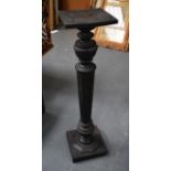 A CARVED HARDWOOD PLANT STAND. 3 FT 6ins high.