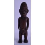 AN AFRICAN CARVED HARDWOOD FERTILITY FIGURE modelled as a male with his genitals exposed. 35 cm