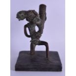 A GOOD 19TH CENTURY AFRICAN BENIN BRONZE FIGURE OF A MALE modelled holding aloft a ritual vessel. 19