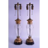 A PAIR OF EARLY 20TH CENTURY FRENCH ORMOLU AND CUT GLASS LAMPS in the neo classical style. Vase 40