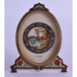 AN EARLY 20TH CENTURY FRENCH CARVED PAINTED IVORY STRUT CLOCK decorated with a landscape, encased