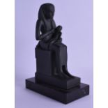 AN EGYPTIAN STYLE FIGURE OF A PHAROAH modelled with an attendant. 22 cm x 14 cm.