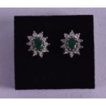 A PAIR OF 9CT GOLD EMERALD AND DIAMOND EARRINGS.