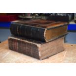TWO 19TH CENTURY LEATHER AND WOODEN BOUND BIBLES. (2)