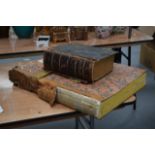 A LARGE ANTIQUE HOLY BIBLE together with a leather bound issue of the times C1877. (2)