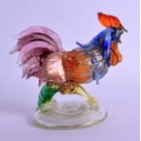 A VENETIAN MURANO ART GLASS FIGURE OF A ROAMING HEN upon a circular base. 17 cm wide.