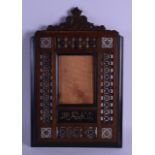 A 19TH CENTURY OTTOMAN TYPE MOTHER OF PEARL INLAID PHOTOGRAPH FRAME decorated with a panel of