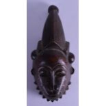 AN EARLY 20TH CENTURY AFRICAN CARVED HARDWOOD MASK with large hair piece. 37 cm x 17 cm.