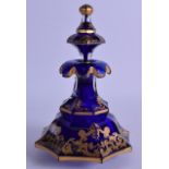 A 19TH CENTURY BOHEMIAN BLUE GLASS PERFUME BOTTLE AND STOPPER highlighted in gilt with scrolling