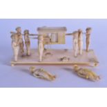 A LARGE 19TH CENTURY INDIAN CARVED IVORY RECTANGULAR FIGURAL GROUP depicting figures carrying