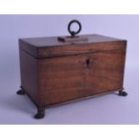 A LARGE EARLY 19TH CENTURY MAHOGANY RECTANGULAR TEA CADDY supported upon claw feet, with fitted