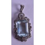AN ANTIQUE SILVER AND PASTE STONE PENDANT set with a blue stone.