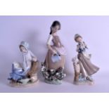 A LLADRO FIGURE OF A FEMALE together with two other lladro figures. Largest 30 cm high. (3)