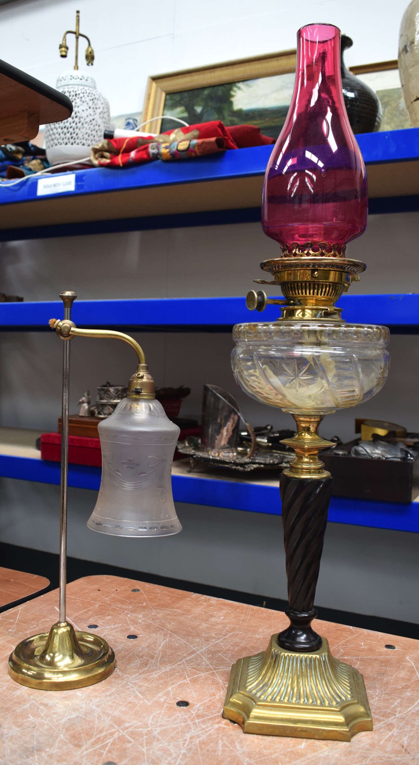 A VICRORIAN OIL LAMP together with an adjustable brass lamp. 71 cm & 44 cm.