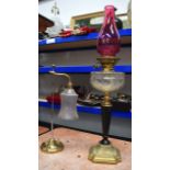 A VICRORIAN OIL LAMP together with an adjustable brass lamp. 71 cm & 44 cm.