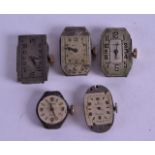 A GROUP OF FIVE VINTAGE ROLEX WATCH DIALS and movements, one circular, one oval & three rectangular.