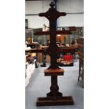 A LARGE MAHOGANY COAT STAND, carved with flowers in panels. 6 ft 11ins high.