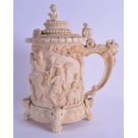 A FINE 19TH CENTURY EUROPEAN CARVED IVORY TANKARD with figural terminal, carved with figures in