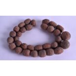 AN EARLY CONTINENTAL TERRACOTTA BEAD NECKLACE. 64 cm long.