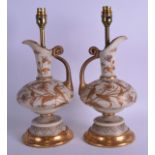 AN UNUSUAL PAIR OF 19TH CENTURY AESTHETIC MOVEMENT IMITATION IVORY GLASS EWERS converted to lamps,