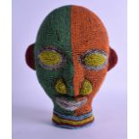 A SMALLER EARLY 20TH CENTURY AFRICAN BAMILEKE BEADED TERRACOTTA MASK decorated with red, green,