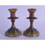 A PAIR OF 19TH CENTURY FRENCH CHAMPLEVE ENAMEL ONYX DWARF CANDLESTICKS decorated with foliage and