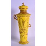 A ROYAL CROWN DERBY AESTHETIC MOVEMENT VASE AND COVER painted in gilt with scrolling flowers. 34.5