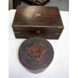 AN EASTERN LACQUERED CIRCULAR BOX AND COVER together with a Victorian rosewood brass bound writing