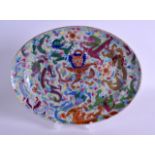 A MID 19TH CENTURY CHINESE CANTON FAMILLE ROSE DISH painted with a central stylised dragons