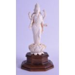 A FINE EARLY 20TH CENTURY INDIAN CARVED IVORY FIGURE OF A BUDDHIST GODDESS the base stamped