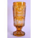 A MID 19TH CENTURY BOHEMIAN AMBER GLASS VASE engraved with panels of various animals within