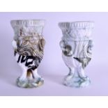 AN UNUSUAL PAIR OF ANTIQUE MARBLED PRESSED GLASS VASES decorated with raised swan heads upon