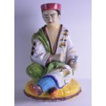 A GOOD LARGE EARLY 20TH CENTURY EUROPEAN FAIENCE GLAZED POTTERY FIGURE OF A CHINAMAN modelled