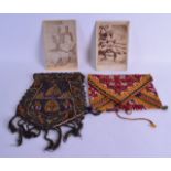 TWO UNUSUAL SOUTH AFRICAN ZULU TYPE SILKWORK PURSES OR POUCHES together with two photographs. (4)