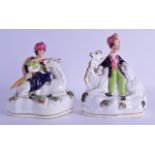 A PAIR OF 19TH CENTURY STAFFORDSHIRE FIGURES OF A MALE AND FEMALE each modelled seated upon a camel.