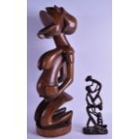 A LARGE UNUSUAL AFRICAN CARVED HARDWOOD FERTILITY FIGURE together with a smaller erotic African