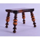 AN ANTIQUE LIGNUM VITAE HARDWOOD STOOL with bobbin turned legs. 17 cm x 13.5 cm.